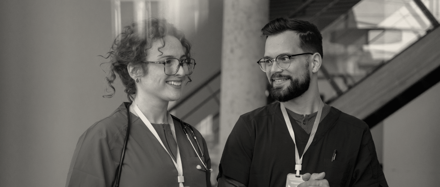 Clinicians speaking in hospital hallway case study image